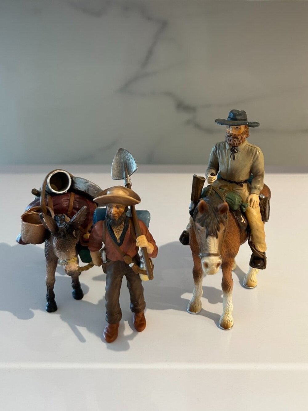 Schleich: Wild West Trapper + Horse (70304) and Gold Prospector + Donkey (70310)